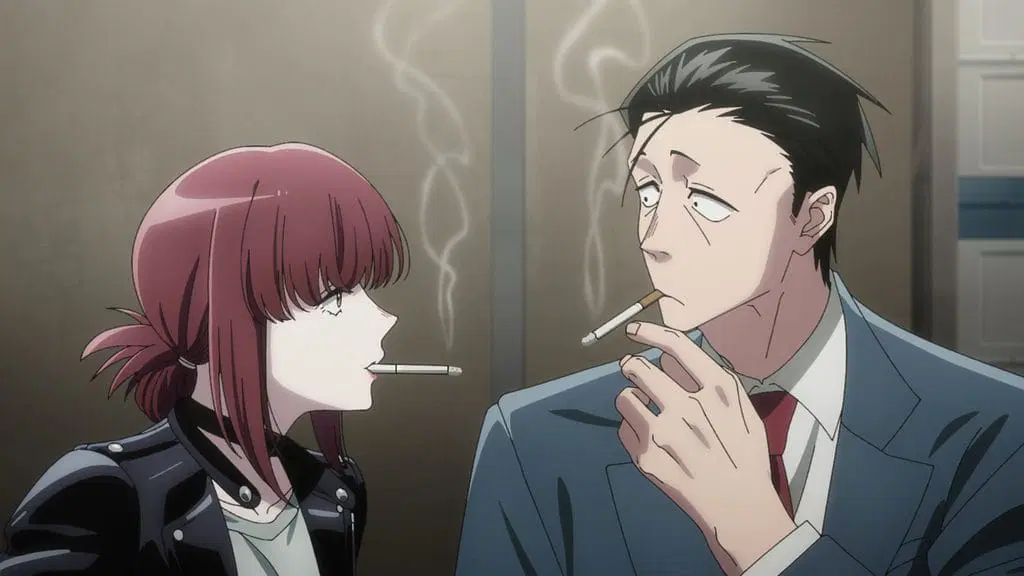 Still from Smoking Behind the Supermarket With You showing in close-up Tayama, a red-haired woman wearing a black leather jacket, and Sasaki, a middle-aged man with black hair and a blue suit. The two look at each other with lit cigarettes hanging from their mouths.